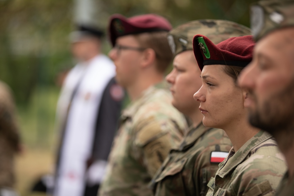 Dignitaries, members of 10th Special Forces Group (Airborne), Polish special forces, 6th Airborne Brigade, gather for the renaming of Camp Miron, May 17, 2024 near Krakow Poland.