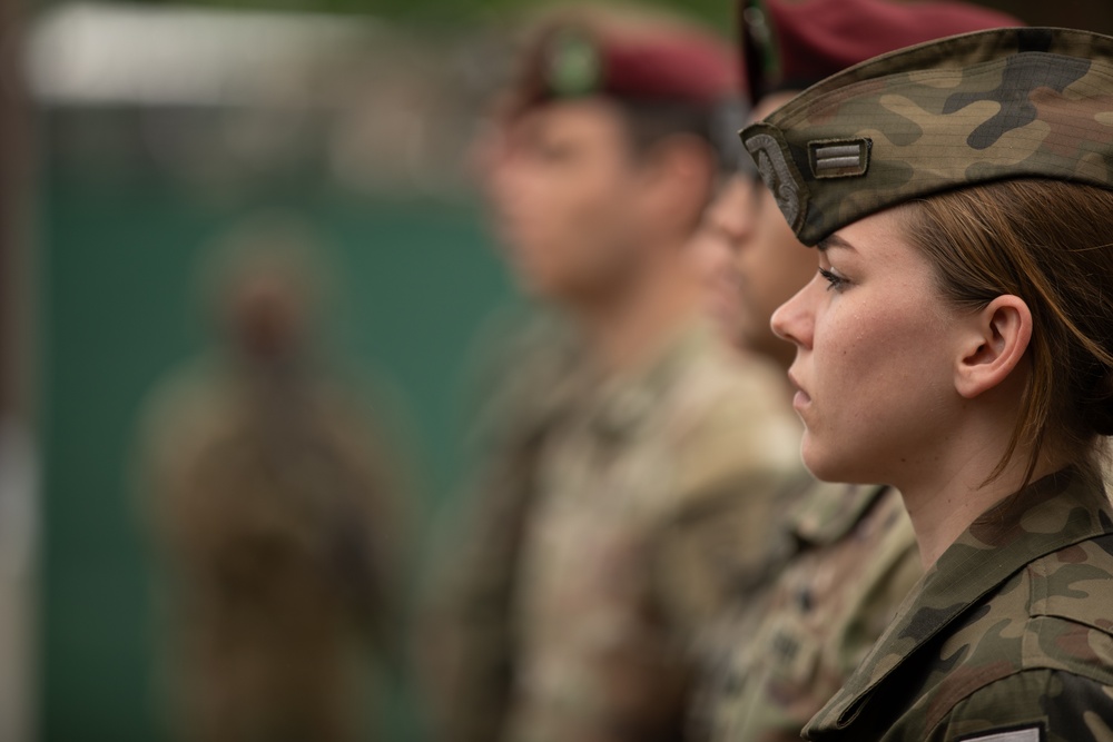 Dignitaries, members of 10th Special Forces Group (Airborne), Polish special forces, 6th Airborne Brigade, gather for the renaming of Camp Miron, May 17, 2024 near Krakow Poland.