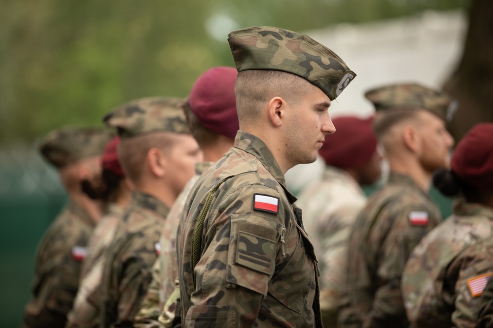 Dignitaries, members of 10th Special Forces Group (Airborne), Polish special forces, 6th Airborne Brigade, gather for the renaming of Camp Miron, May 17, 2024 near Krakow Poland.