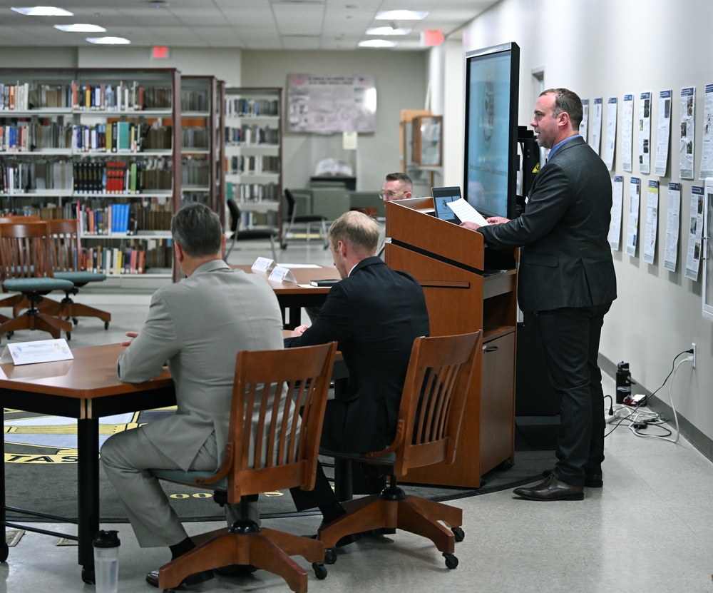 A student from the National Defense University, who is in the College of International Security Affairs Masters Program, delivers a speech during the Spring Symposium/Irregular Warfare Forum