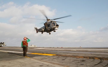 Brazilian Navy Helicopter Takes off From the George Washington