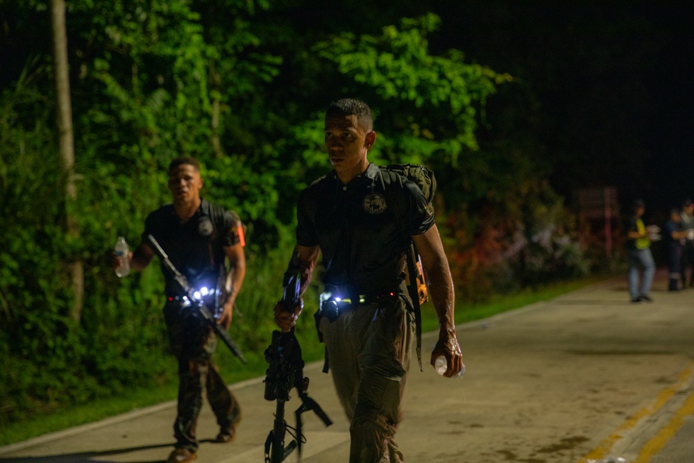 Competitors take part in Fuerzas Comando 2024 Night Ruck March