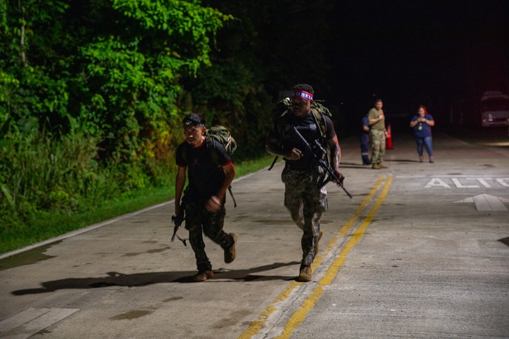 Competitors take part in Fuerzas Comando 2024 Night Ruck March