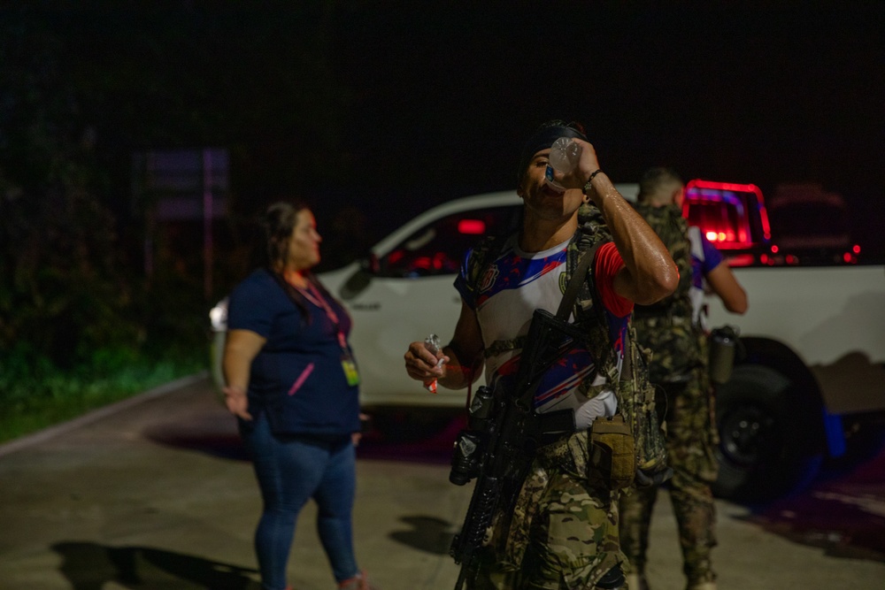 Competitors take part in Fuerzas Comando 2024 Night Ruck March