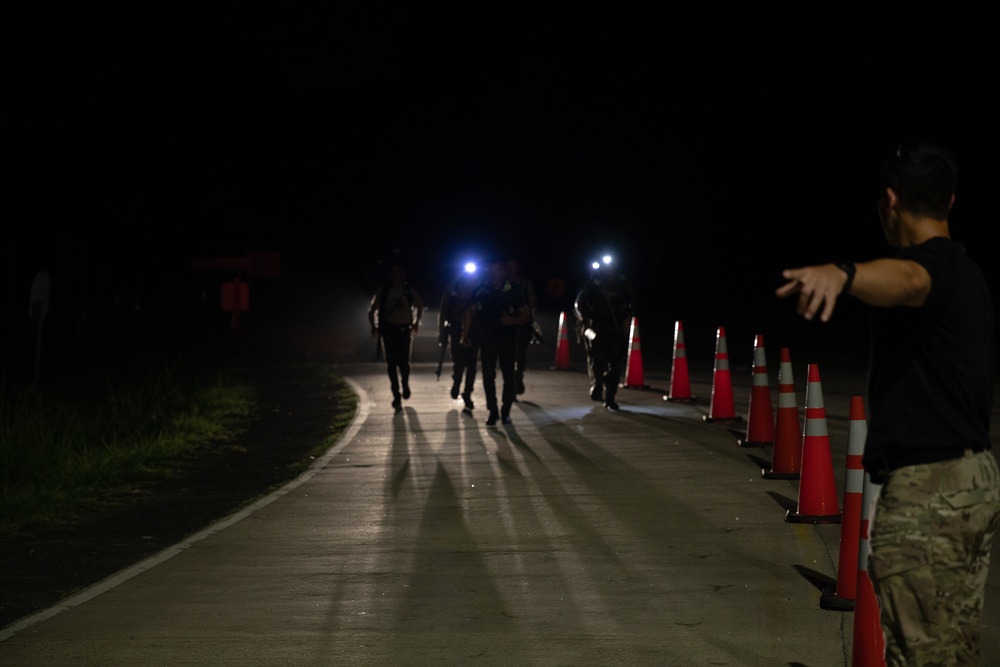 Competitors take part in Fuerzas Comando 2024 Night Ruck March