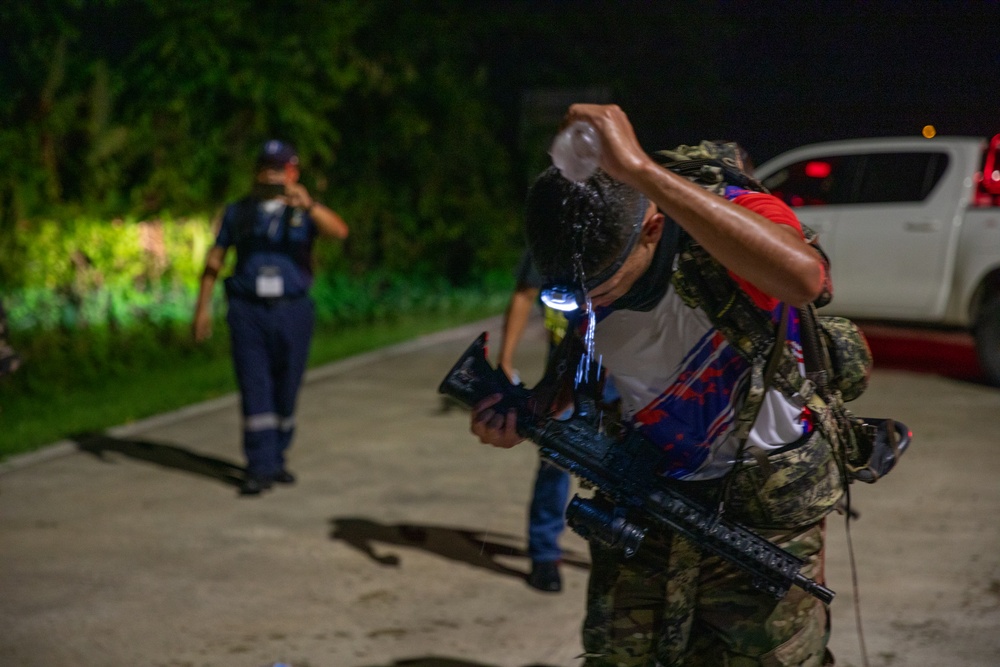 Competitors take part in Fuerzas Comando 2024 Night Ruck March