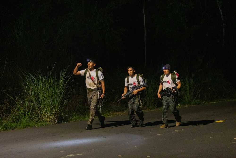 Competitors conduct Fuerzas Comando 24 Night Ruck March