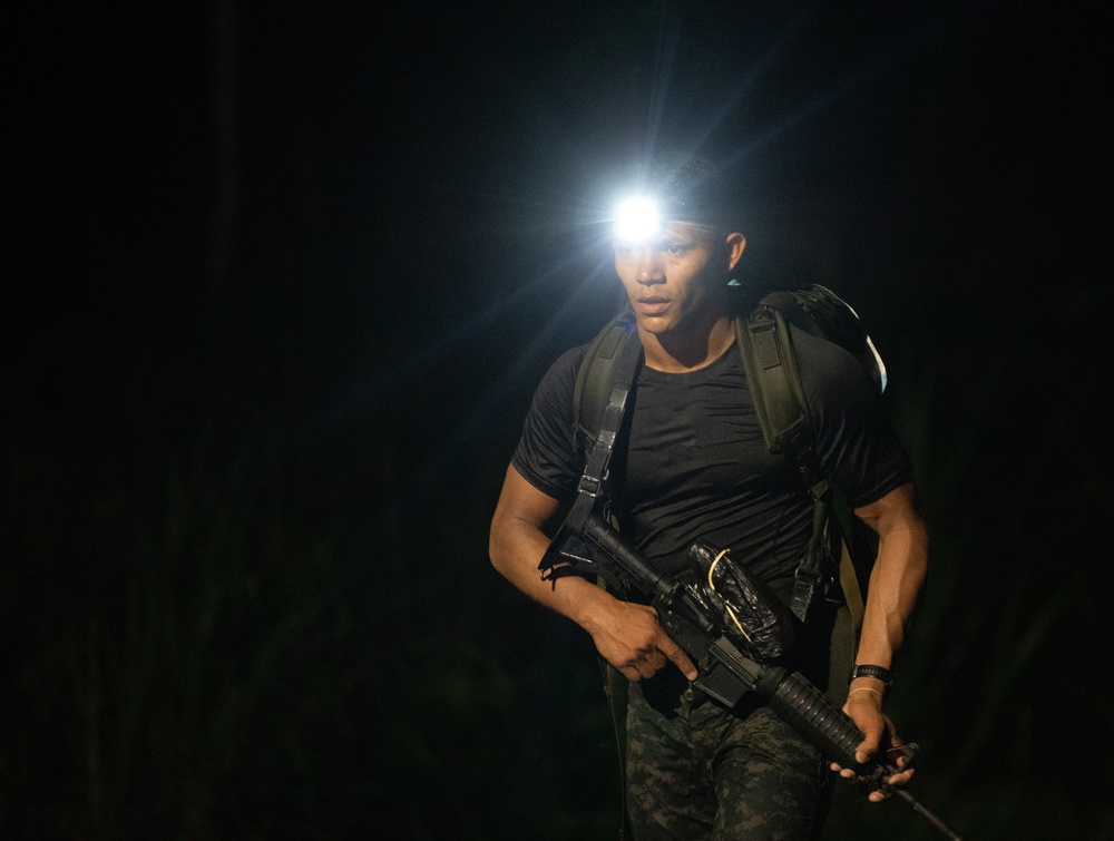 Competitors conduct Fuerzas Comando 24 Night Ruck March
