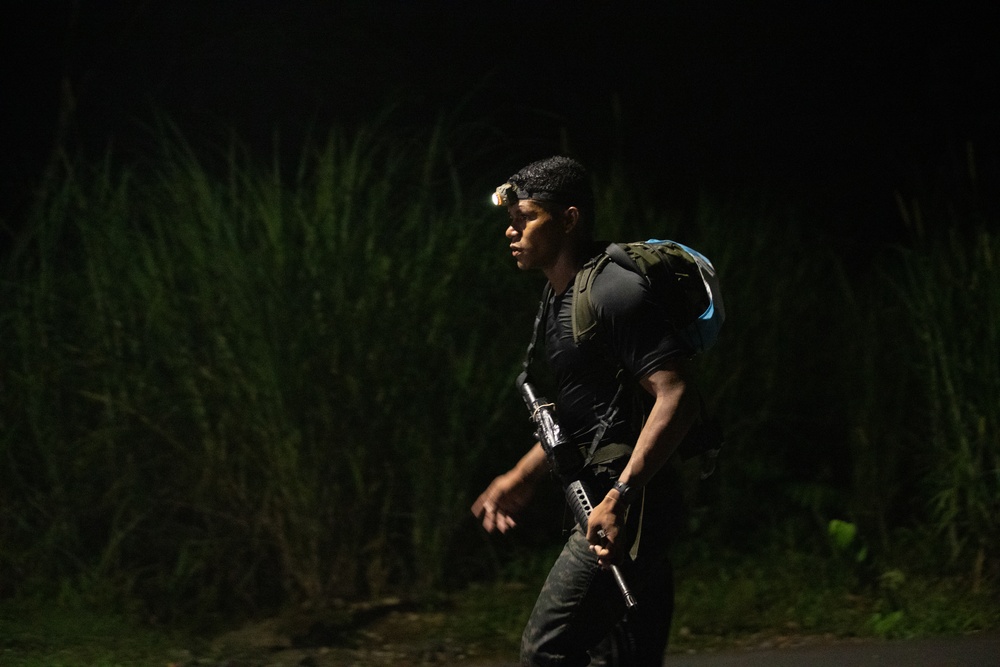 Competitors conduct Fuerzas Comando 24 Night Ruck March