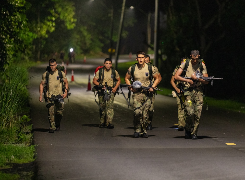 Competitors conduct Fuerzas Comando 24 Night Ruck March