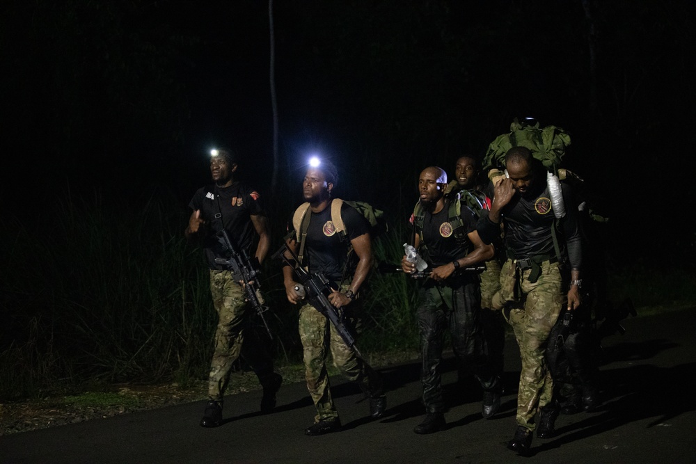 Competitors conduct Fuerzas Comando 24 Night Ruck March