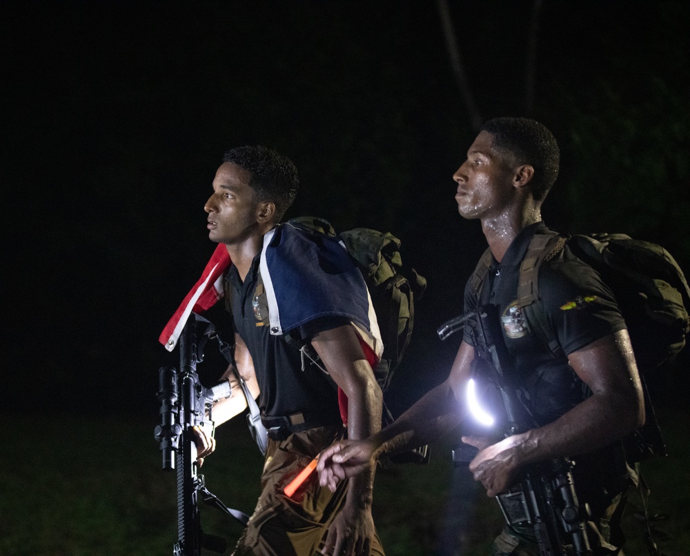 Competitors conduct Fuerzas Comando 24 Night Ruck March