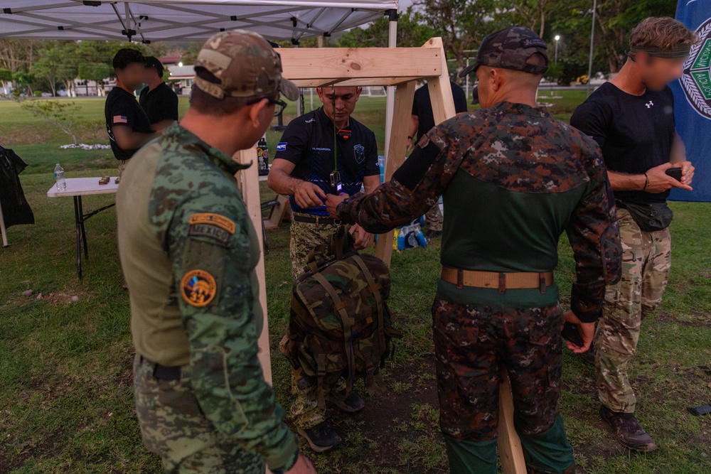 Competitors conduct Fuerzas Comando 24 Night Ruck March