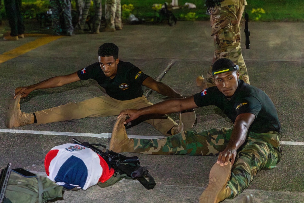 Competitors conduct Fuerzas Comando 24 Night Ruck March