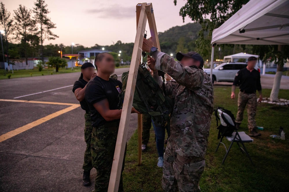 Competitors conduct Fuerzas Comando 24 Night Ruck March