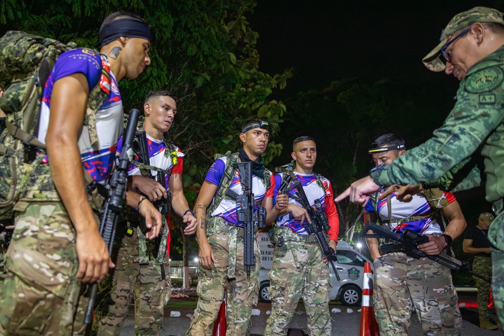 Competitors conduct Fuerzas Comando 24 Night Ruck March