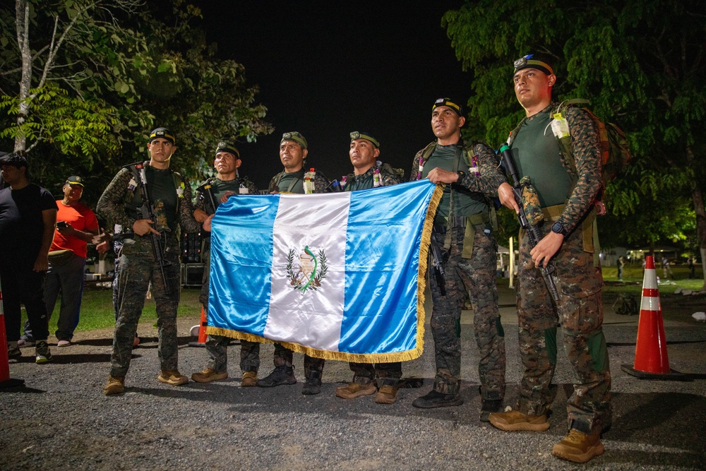 Competitors conduct Fuerzas Comando 24 Night Ruck March