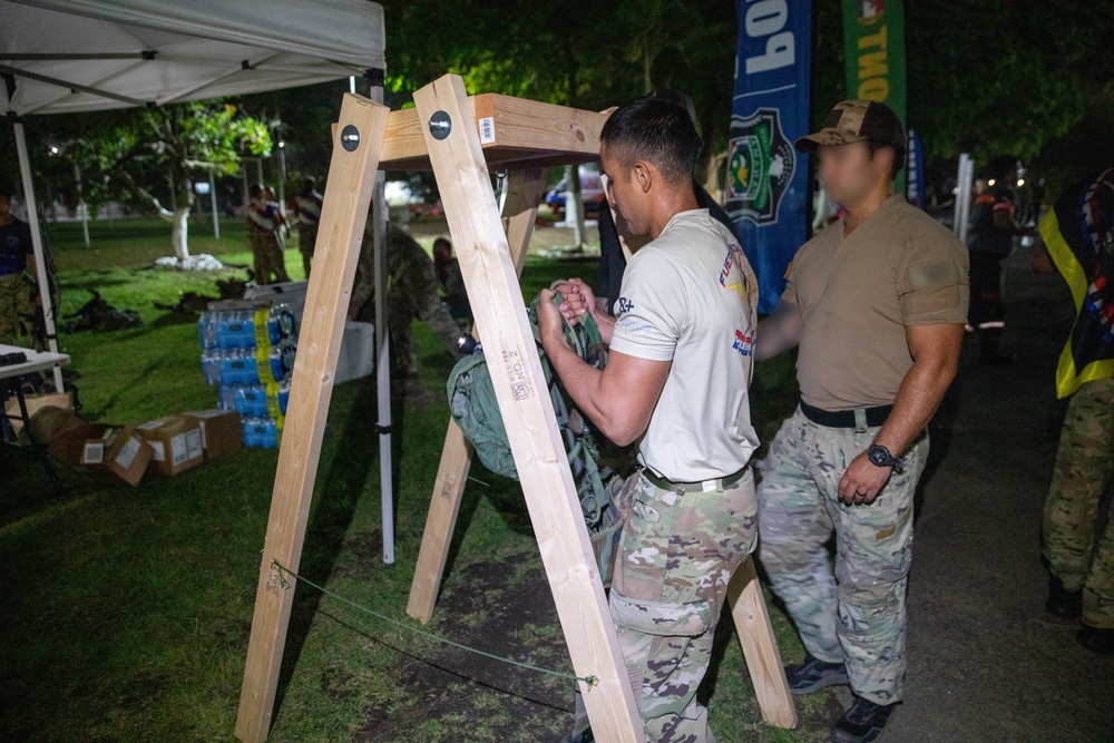 Competitors conduct Fuerzas Comando 24 Night Ruck March