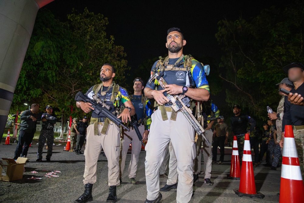 Competitors conduct Fuerzas Comando 24 Night Ruck March