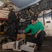 Sailors perform maintenance on aircraft aboard Abraham Lincoln