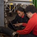 Sailors perform maintenance on aircraft aboard Abraham Lincoln