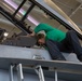 Sailors perform maintenance on aircraft aboard Abraham Lincoln