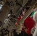 Sailors perform maintenance on aircraft aboard Abraham Lincoln