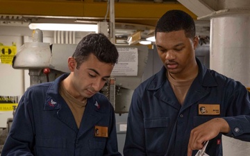 Sailors conduct maintenance aboard Abraham Lincoln