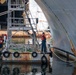 Sailors, assigned to the amphibious assault ship, USS America (LHA 6), conduct preservation work