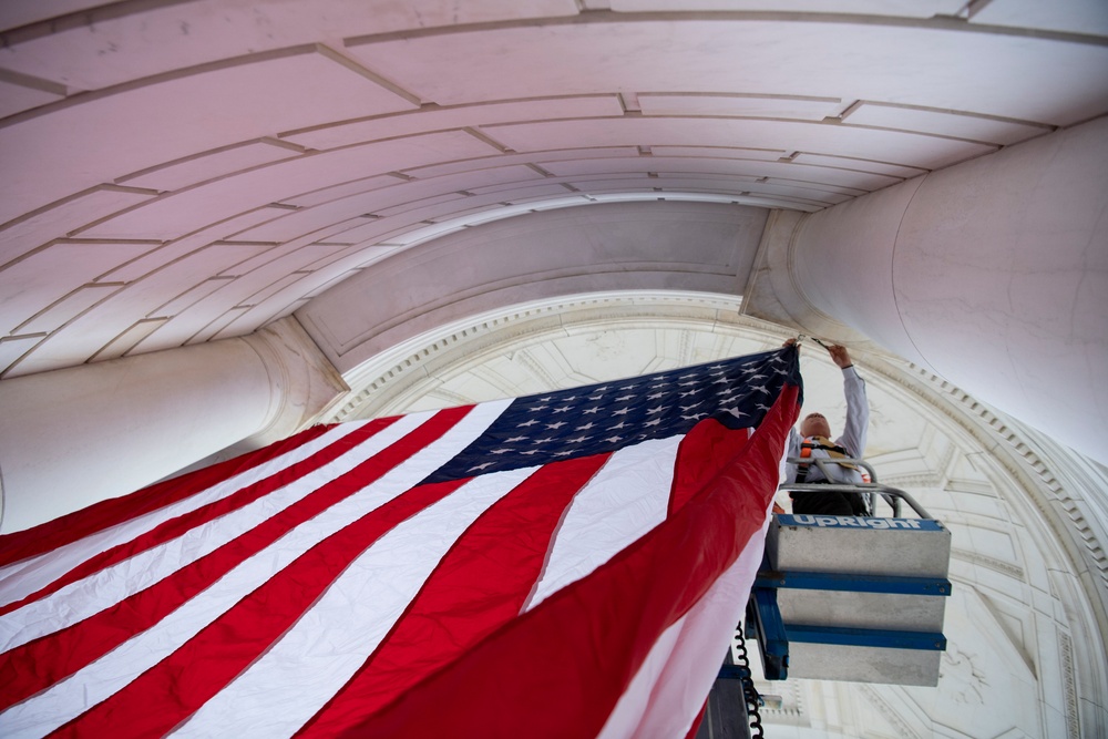 U.S. Flags are Hung in the Memorial Amphitheater in Preparation for the National Memorial Day Observance