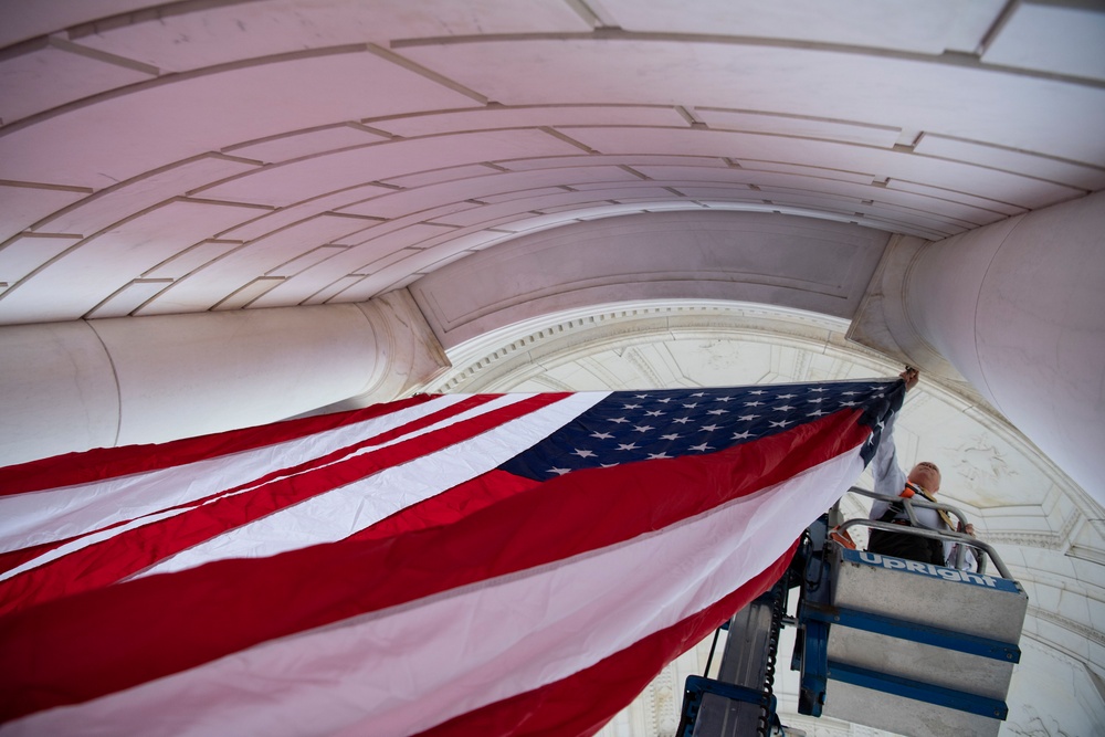 U.S. Flags are Hung in the Memorial Amphitheater in Preparation for the National Memorial Day Observance