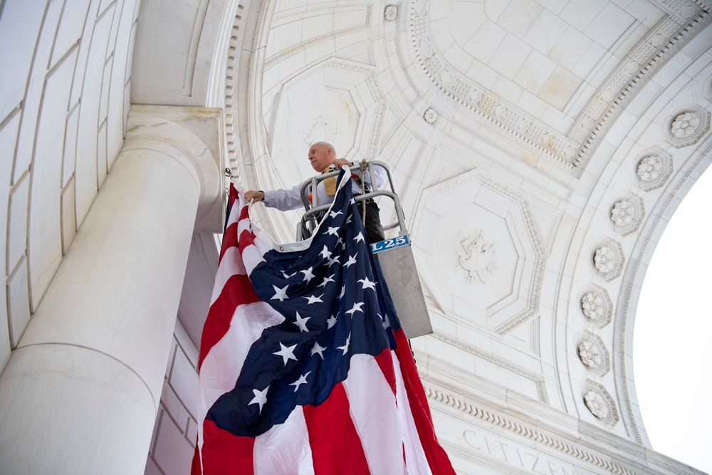 U.S. Flags are Hung in the Memorial Amphitheater in Preparation for the National Memorial Day Observance