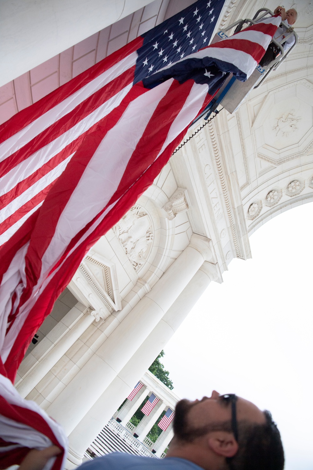 U.S. Flags are Hung in the Memorial Amphitheater in Preparation for the National Memorial Day Observance