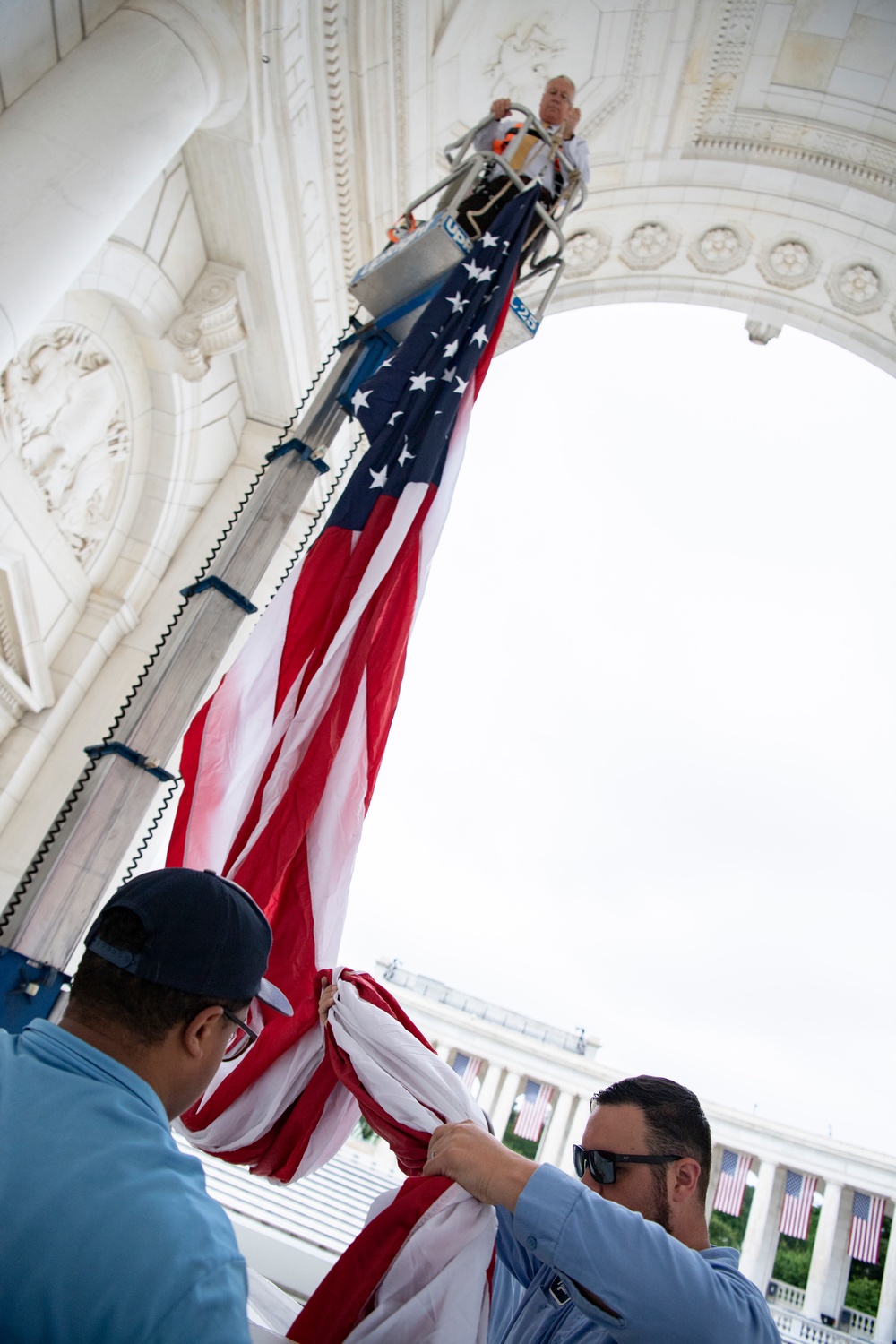 U.S. Flags are Hung in the Memorial Amphitheater in Preparation for the National Memorial Day Observance