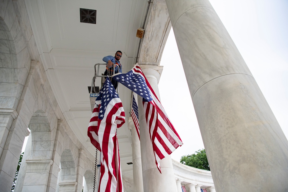 U.S. Flags are Hung in the Memorial Amphitheater in Preparation for the National Memorial Day Observance