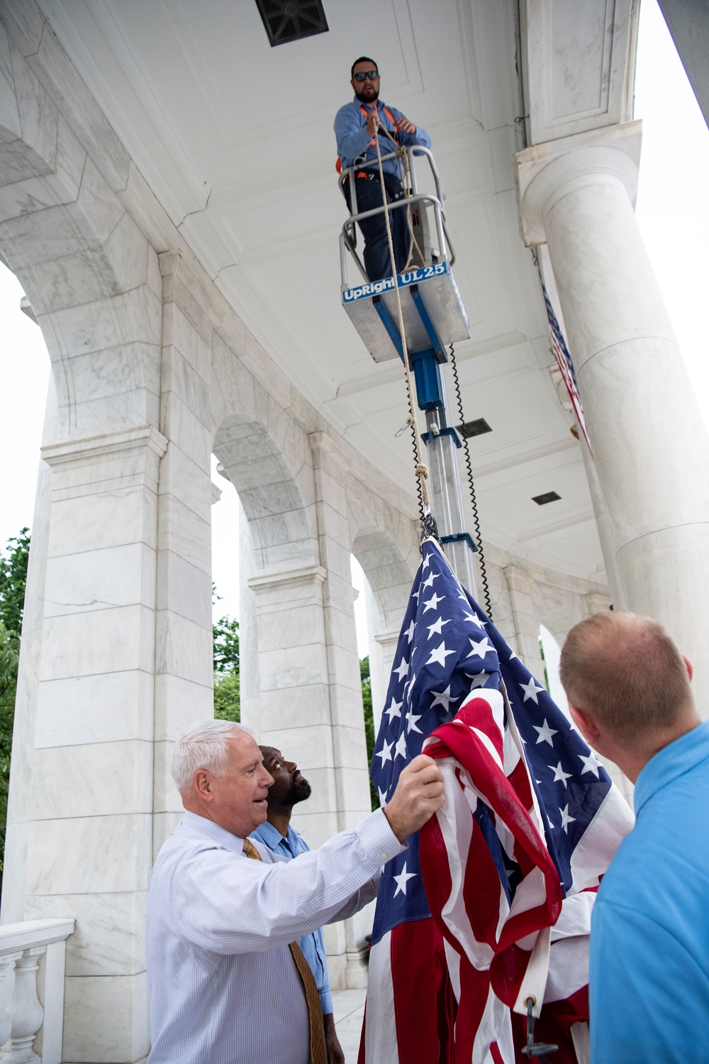 U.S. Flags are Hung in the Memorial Amphitheater in Preparation for the National Memorial Day Observance