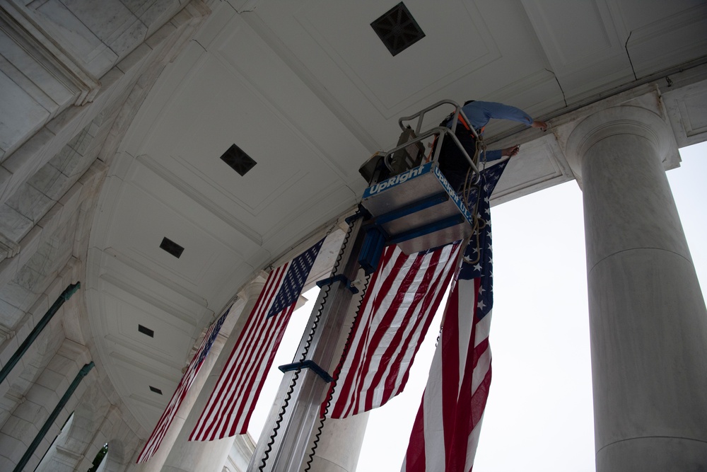 U.S. Flags are Hung in the Memorial Amphitheater in Preparation for the National Memorial Day Observance