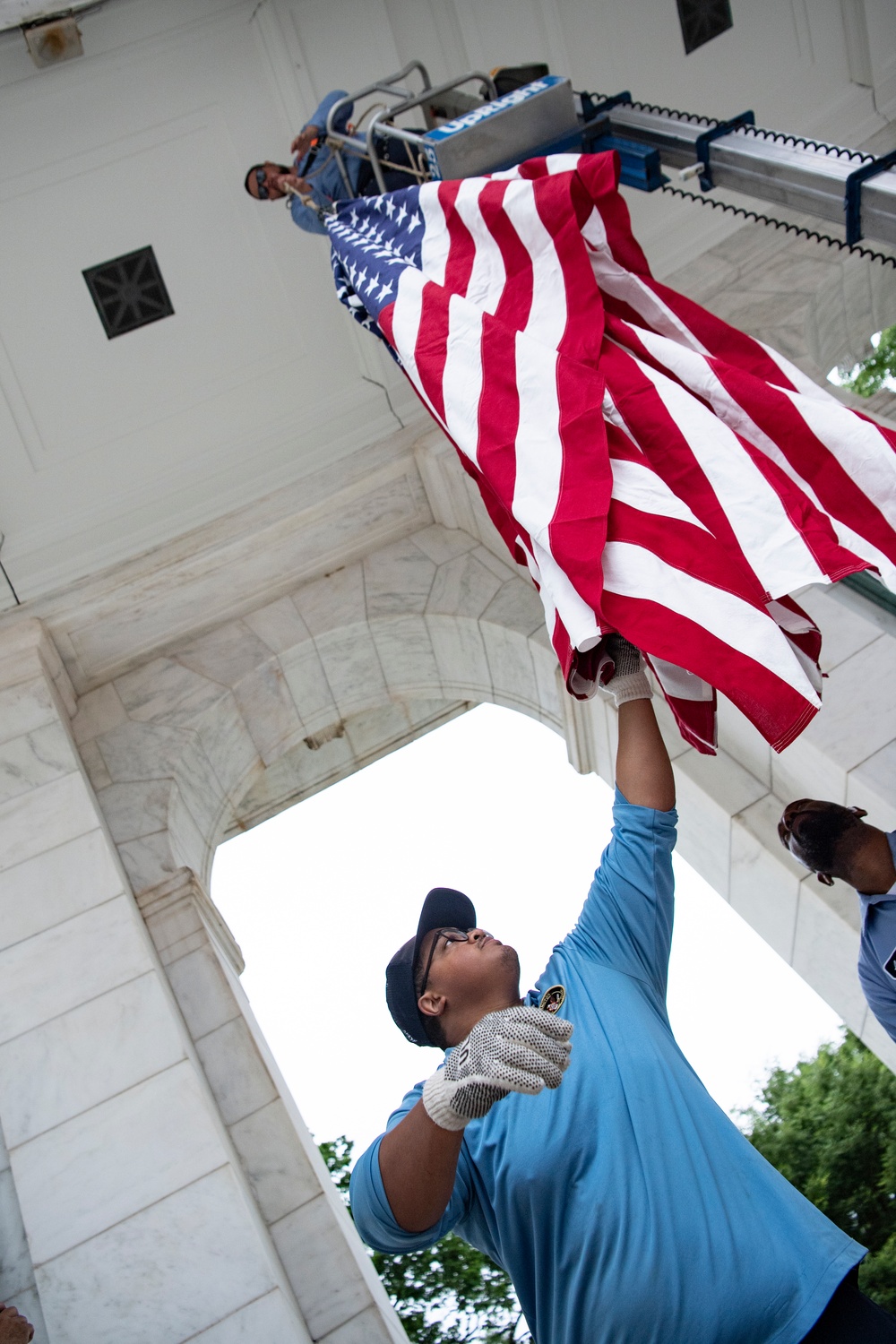 U.S. Flags are Hung in the Memorial Amphitheater in Preparation for the National Memorial Day Observance