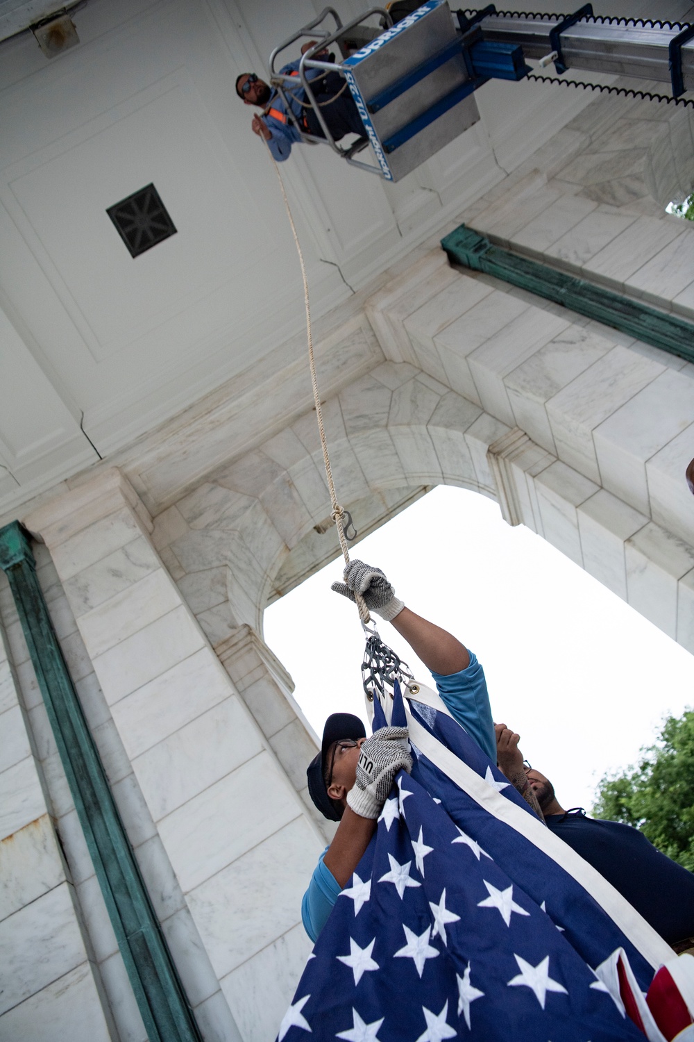 U.S. Flags are Hung in the Memorial Amphitheater in Preparation for the National Memorial Day Observance