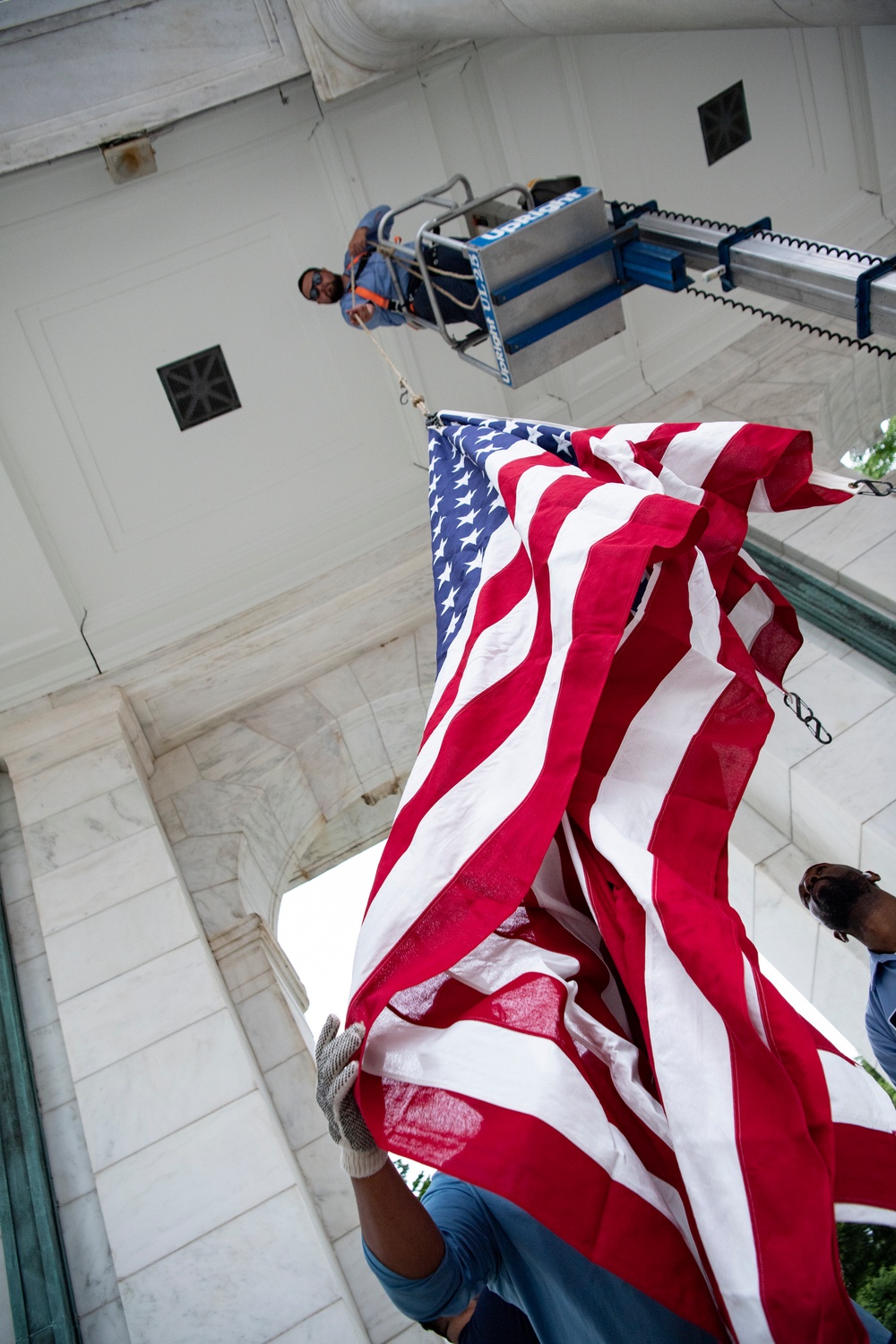 U.S. Flags are Hung in the Memorial Amphitheater in Preparation for the National Memorial Day Observance