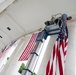 U.S. Flags are Hung in the Memorial Amphitheater in Preparation for the National Memorial Day Observance