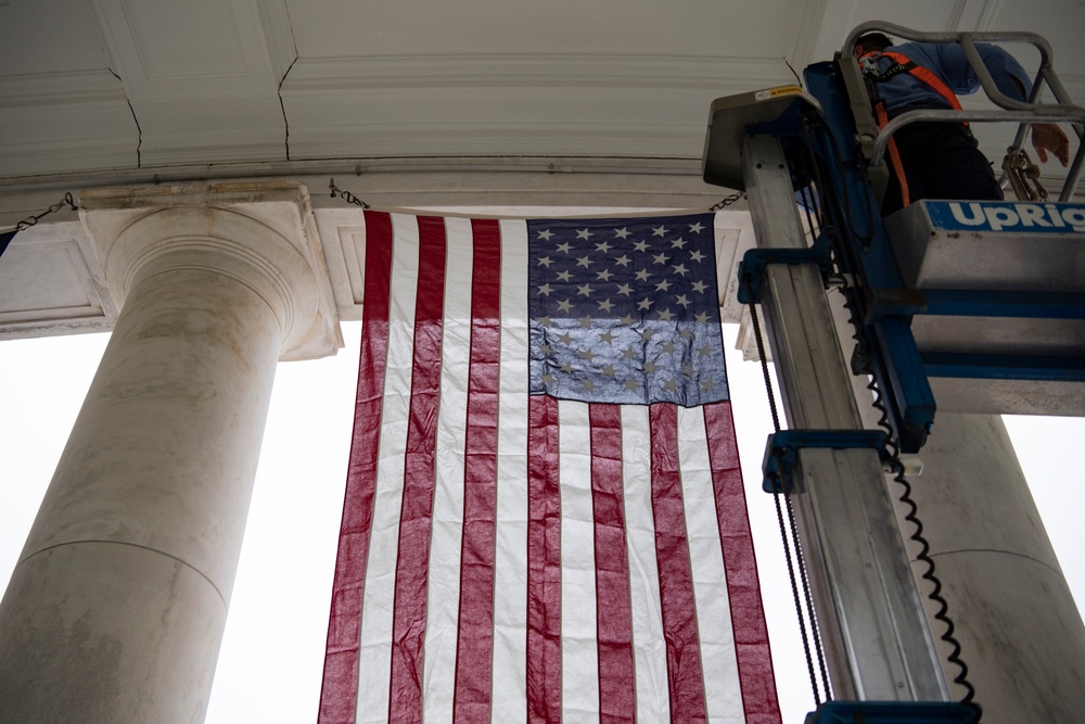 U.S. Flags are Hung in the Memorial Amphitheater in Preparation for the National Memorial Day Observance