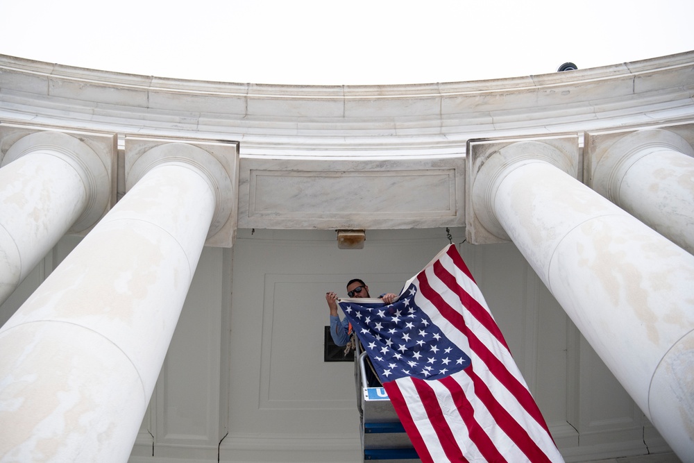 U.S. Flags are Hung in the Memorial Amphitheater in Preparation for the National Memorial Day Observance