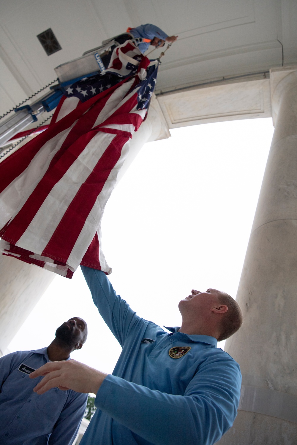 U.S. Flags are Hung in the Memorial Amphitheater in Preparation for the National Memorial Day Observance