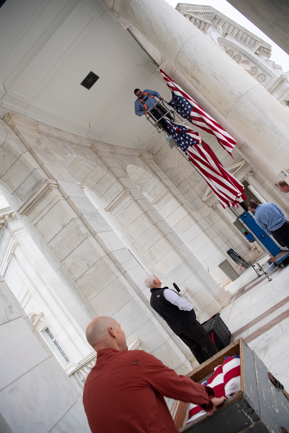 U.S. Flags are Hung in the Memorial Amphitheater in Preparation for the National Memorial Day Observance