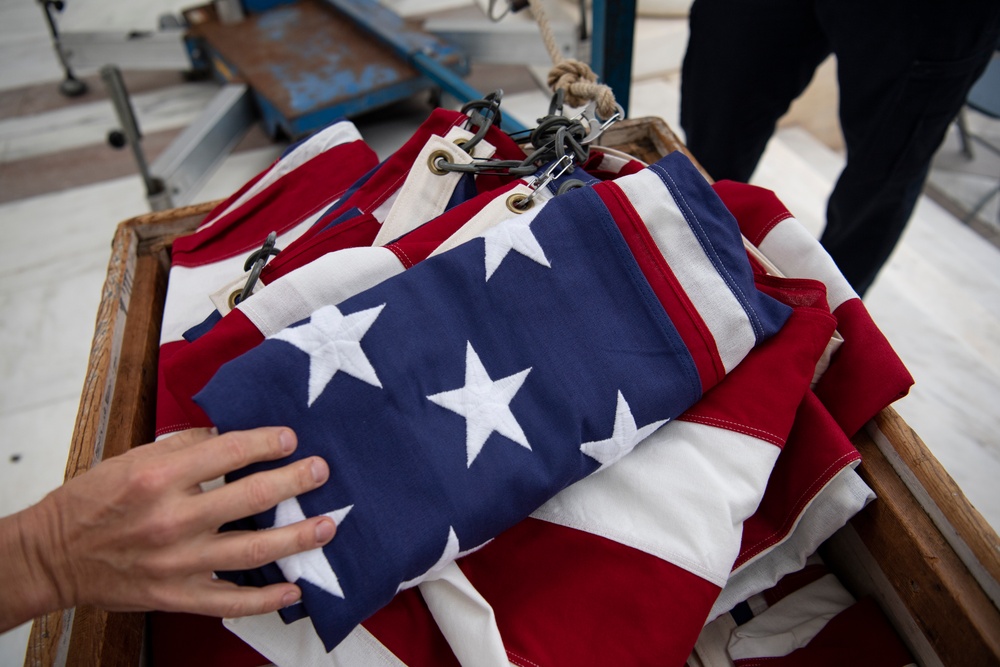 U.S. Flags are Hung in the Memorial Amphitheater in Preparation for the National Memorial Day Observance