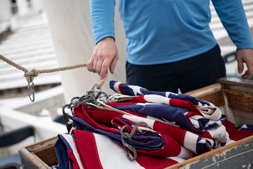 U.S. Flags are Hung in the Memorial Amphitheater in Preparation for the National Memorial Day Observance