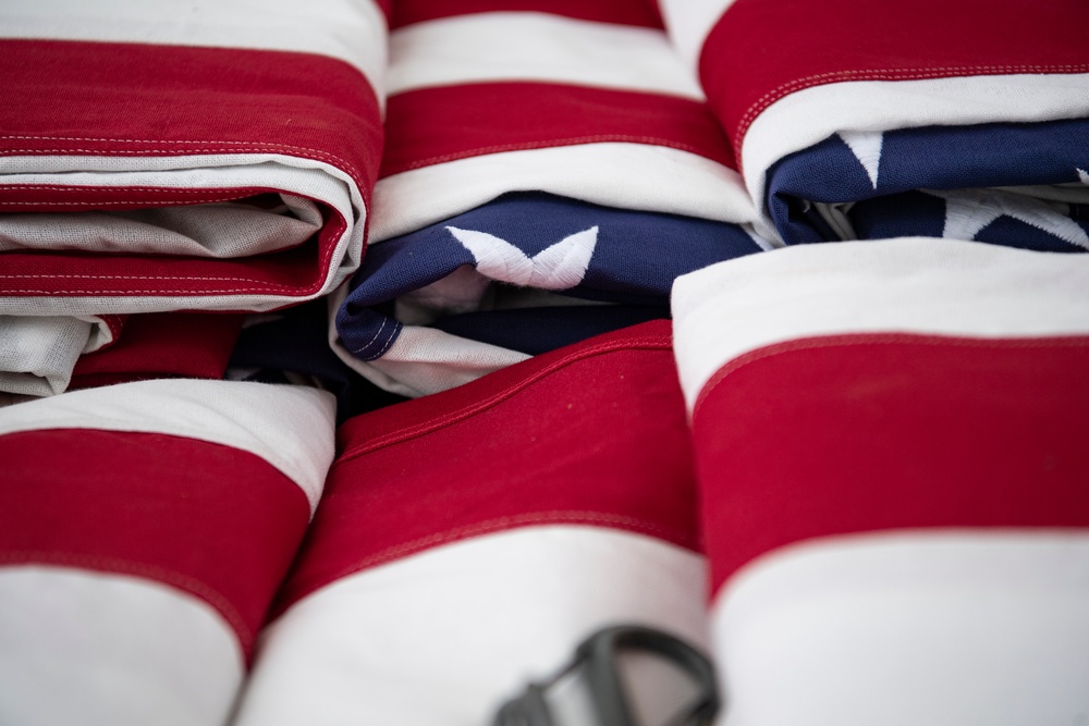 U.S. Flags are Hung in the Memorial Amphitheater in Preparation for the National Memorial Day Observance