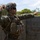 Marines with 3rd Intelligence Battalion throw grenades during a field exercise.