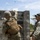 Marines with 3rd Intelligence Battalion throw grenades during a field exercise.